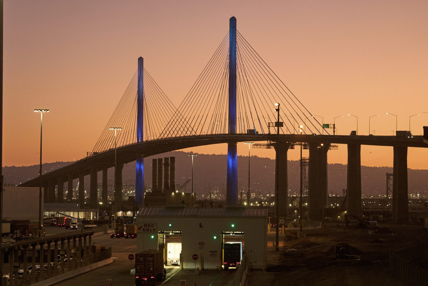 Trucks transporting containers undergo X-ray scanning at entry gates at the Long Beach Container Te...