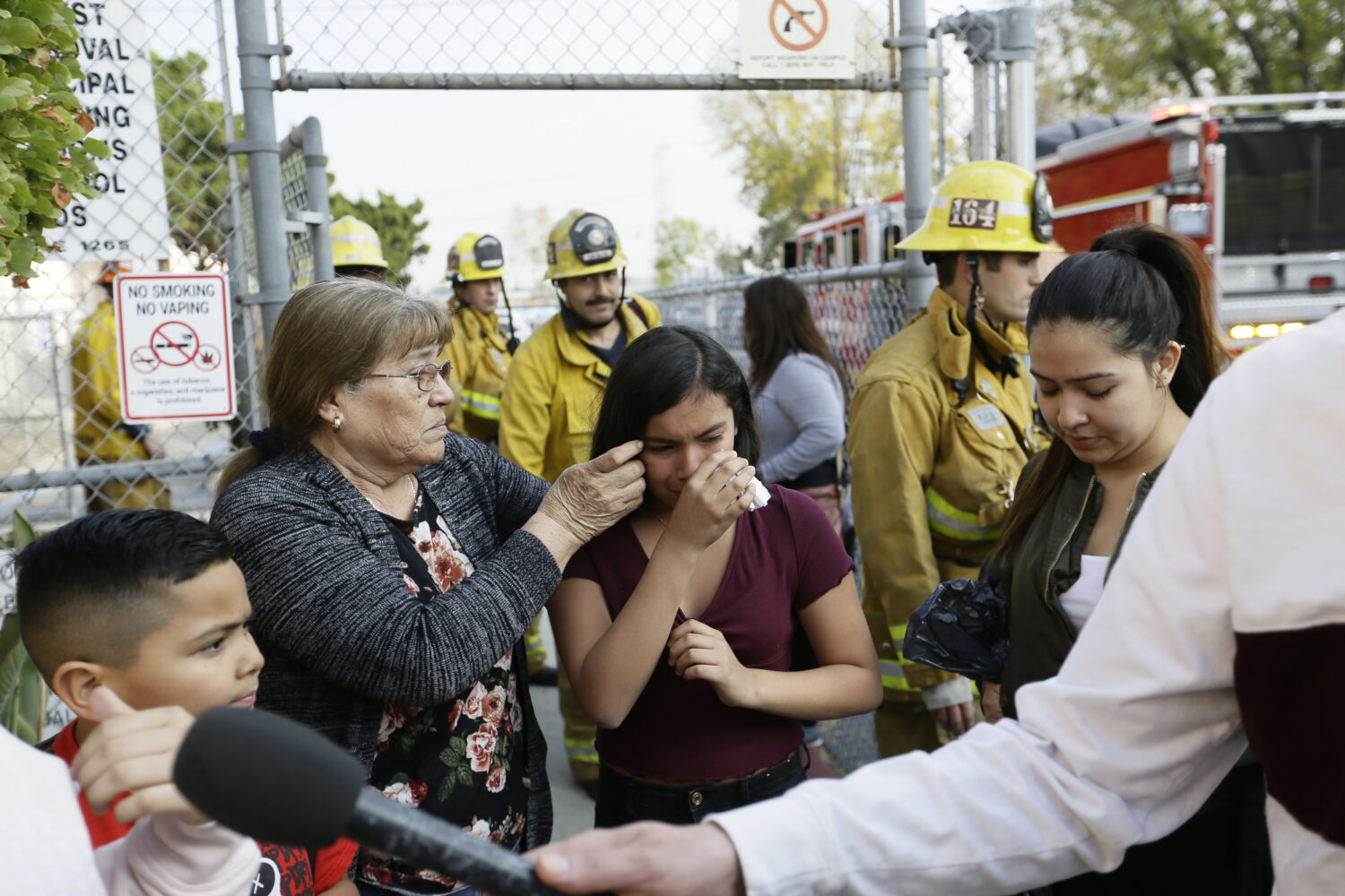 FILE - Student Marianna Torres, 11, center, cries as she evacuates Park Avenue Elementary School af...