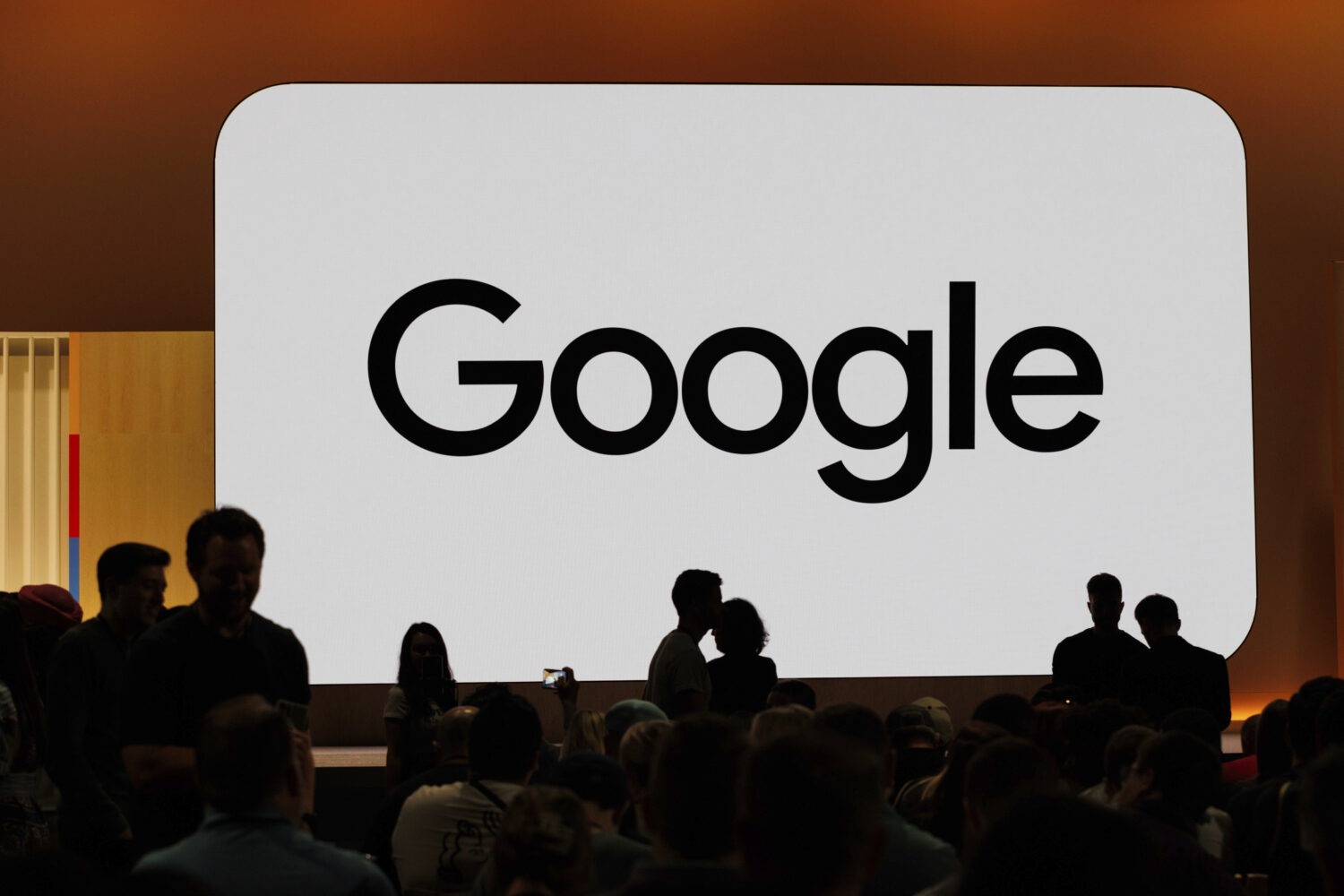 FILE - Audience members gather at Made By Google for new product announcements at Google on Aug. 13...