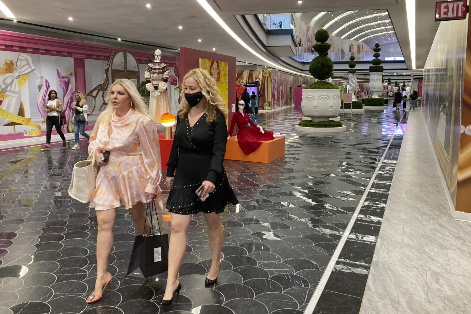 FILE - People walk through the luxury wing at the American Dream shopping mall in East Rutherford, ...