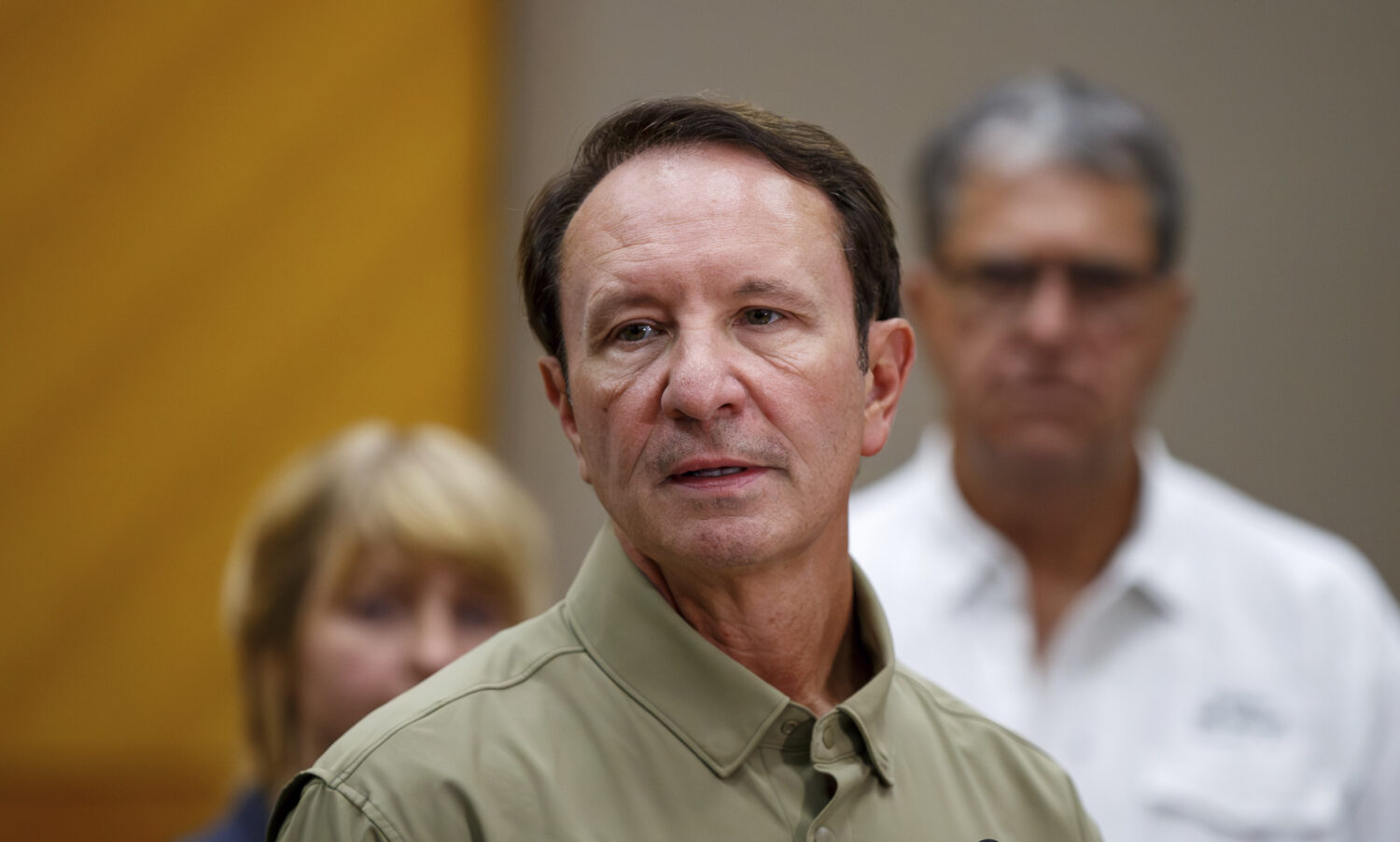 Louisiana Gov. Jeff Landry speaks alongside federal, state and parish officials during a press conf...