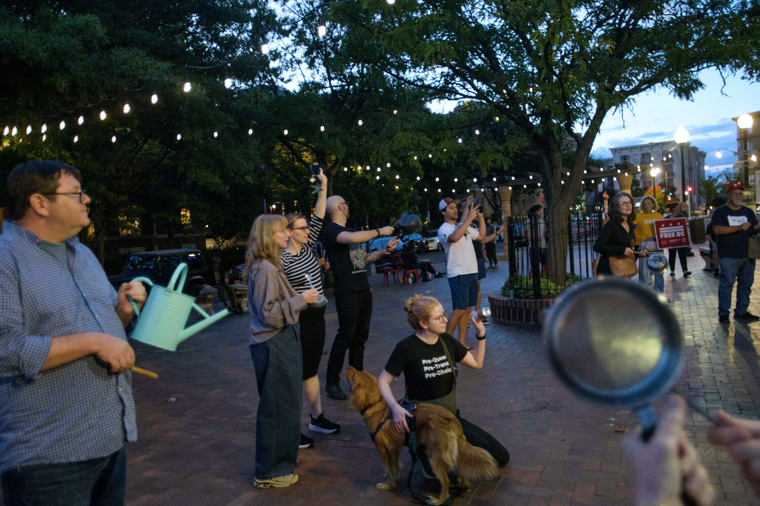 People hold a grassroots, daily, five-minute pots and pans protest to demonstrate against President...