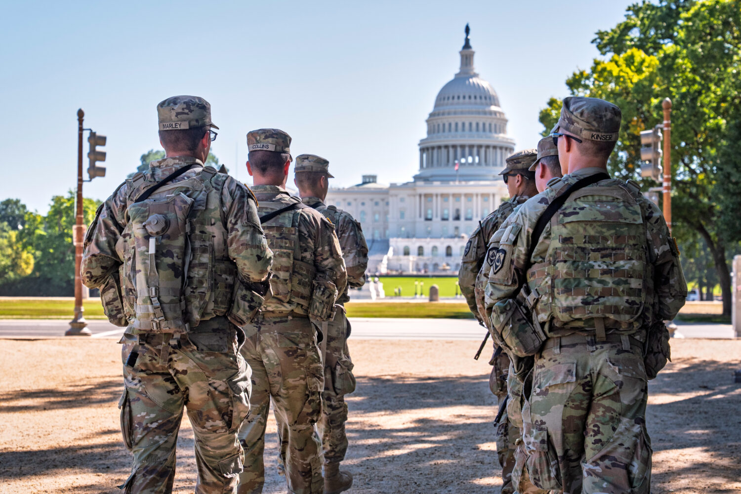 Armed National Guard soldiers from West Virginia patrol the Mall near the Capitol in Washington, as...