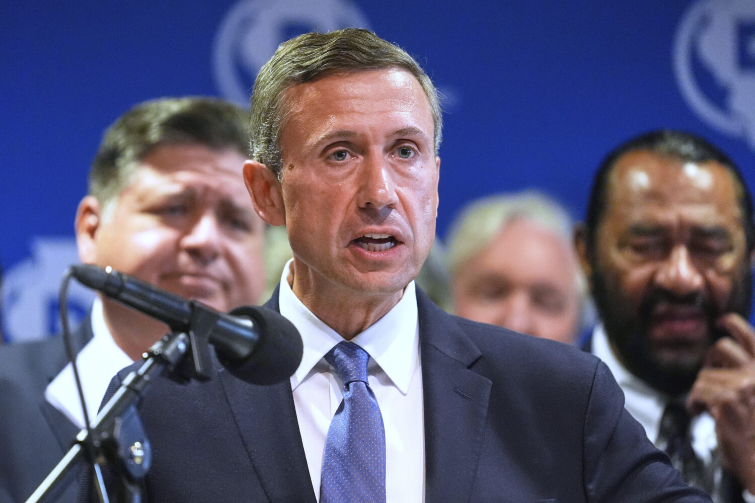 FILE - DNC Chairman Ken Martin speaks during a news conference in Aurora, Ill., Aug 5, 2025. (AP Ph...