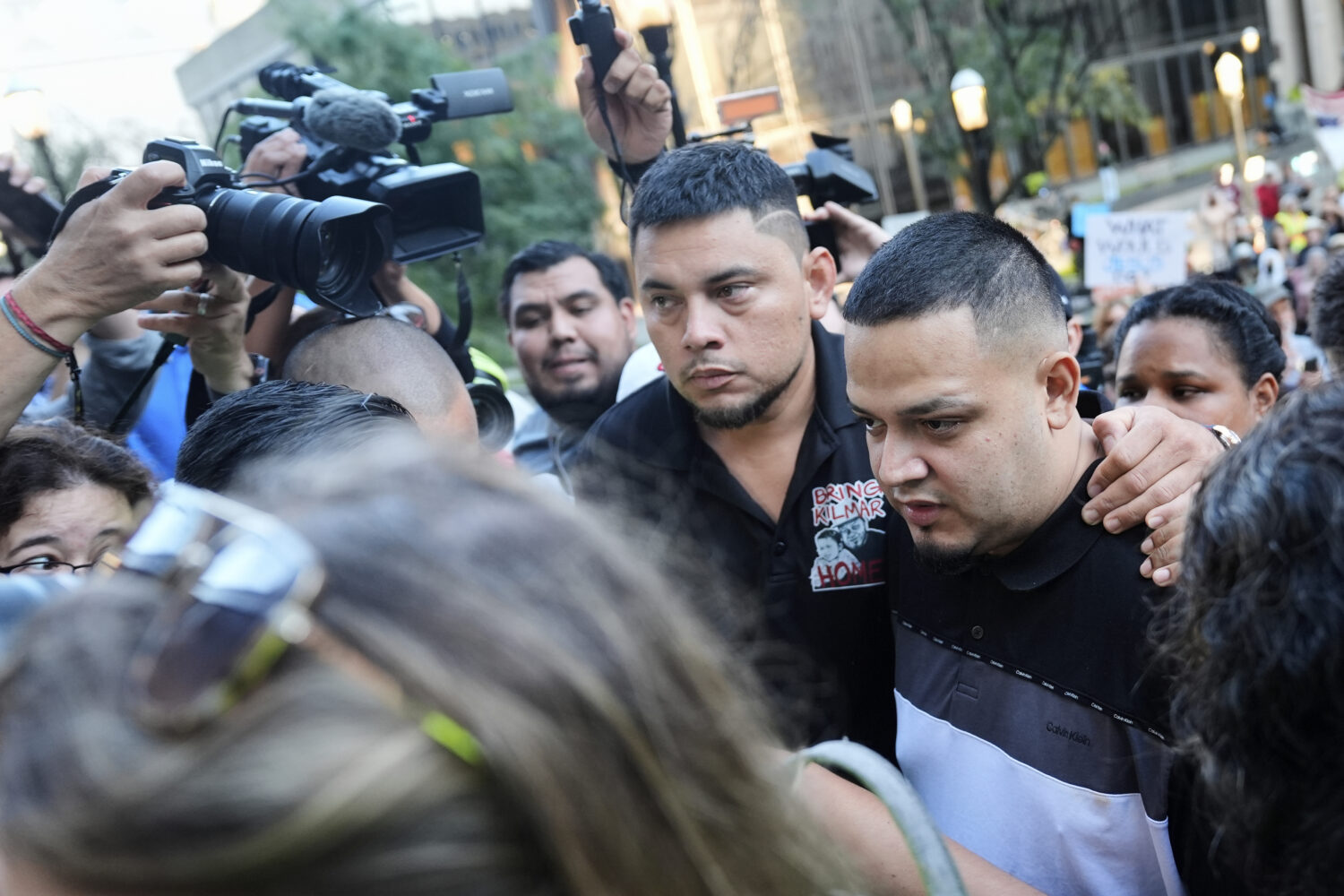 Kilmar Abrego Garcia, right, and his brother Cesar Abrego Garcia, center, arrive at the Immigration...