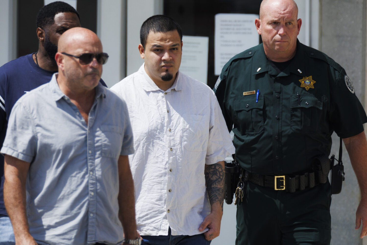 Kilmar Abrego Garcia, center, leaves the Putnam County Jail, Friday, Aug. 22, 2025, in Cookeville, ...