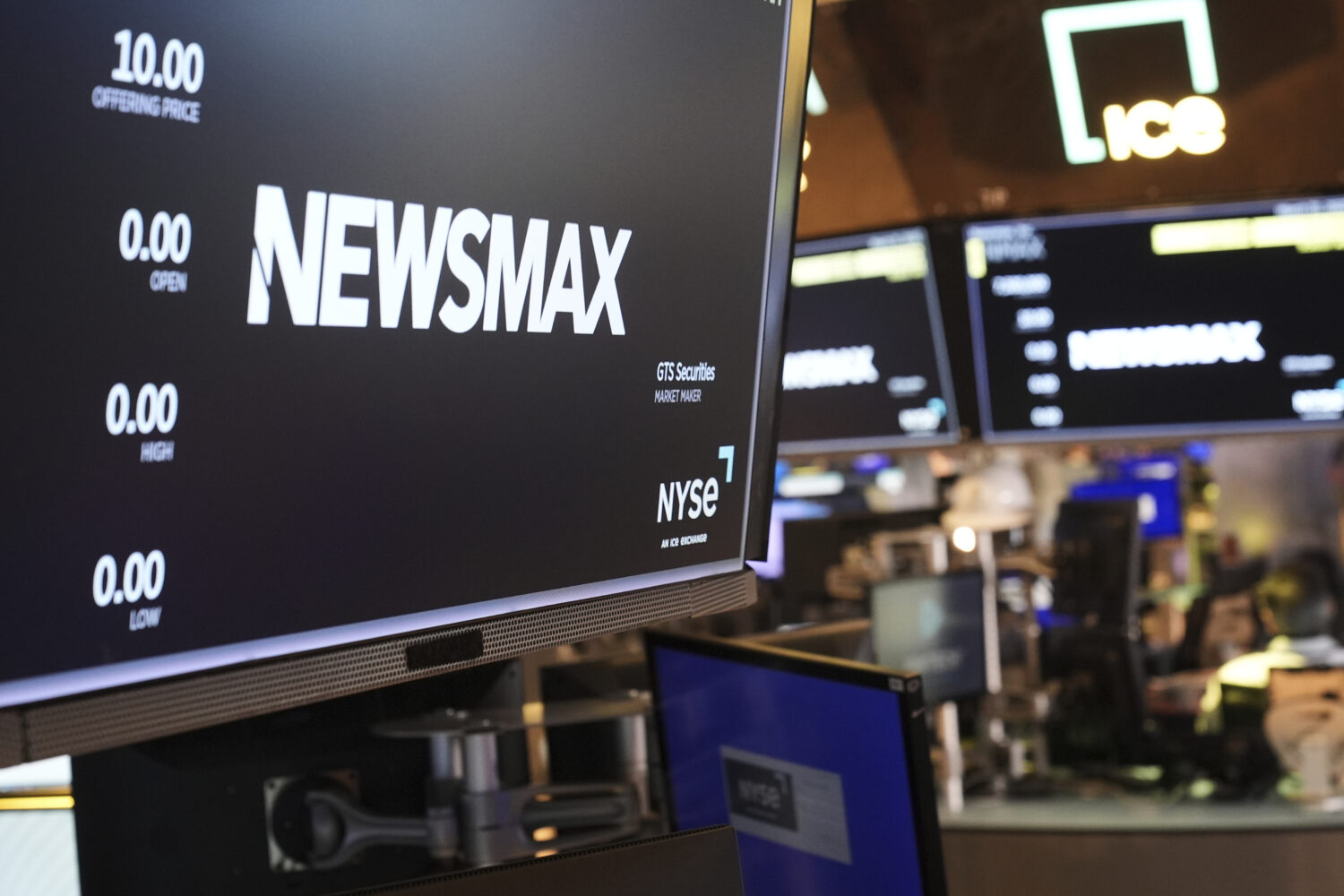 FILE - A display shows a Newsmax logo on the day of their IPO on the floor at the New York Stock Ex...