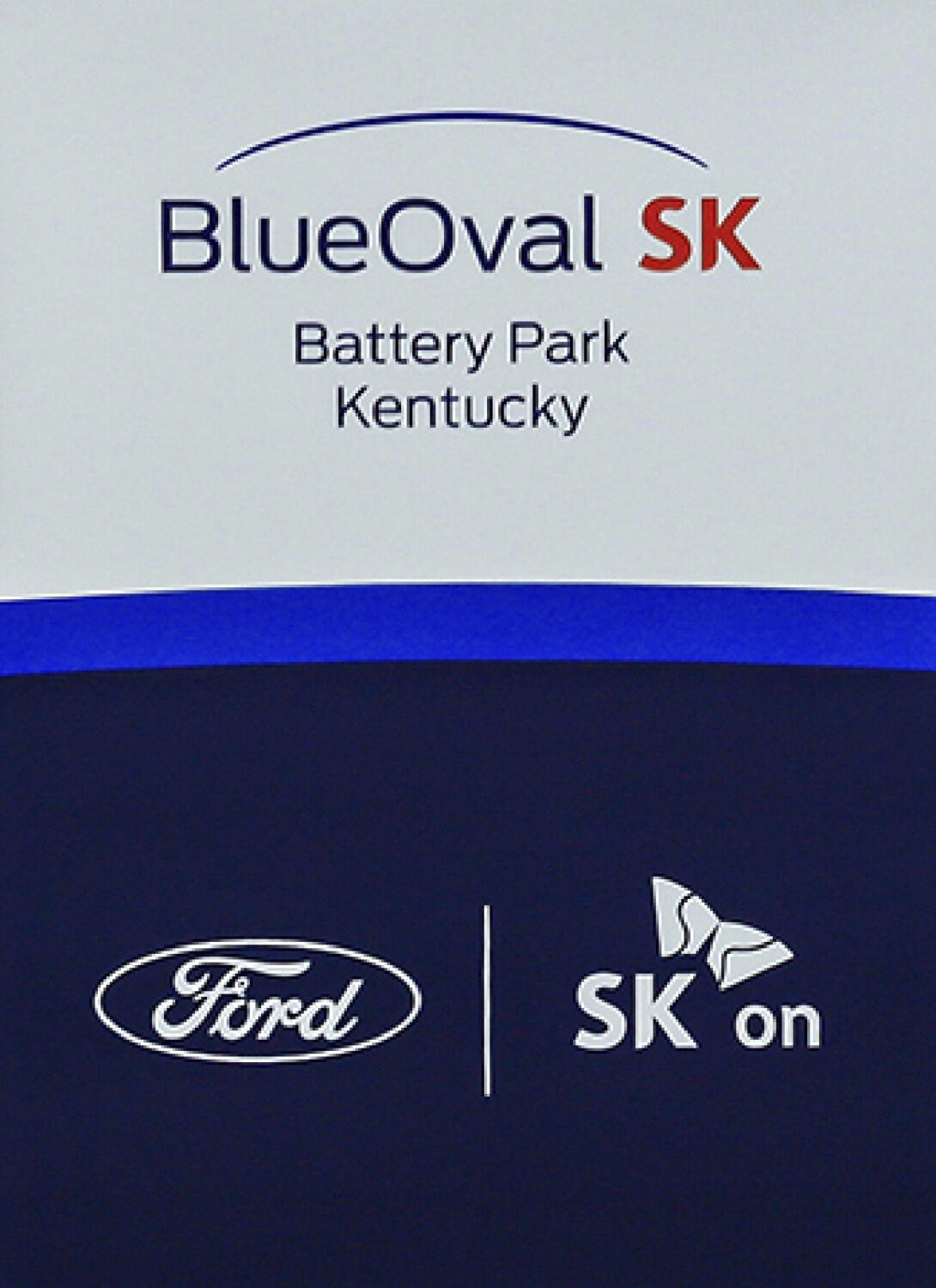 FILE - Logos for BlueOval SK and Ford are displayed on a podium during a celebration for the progre...