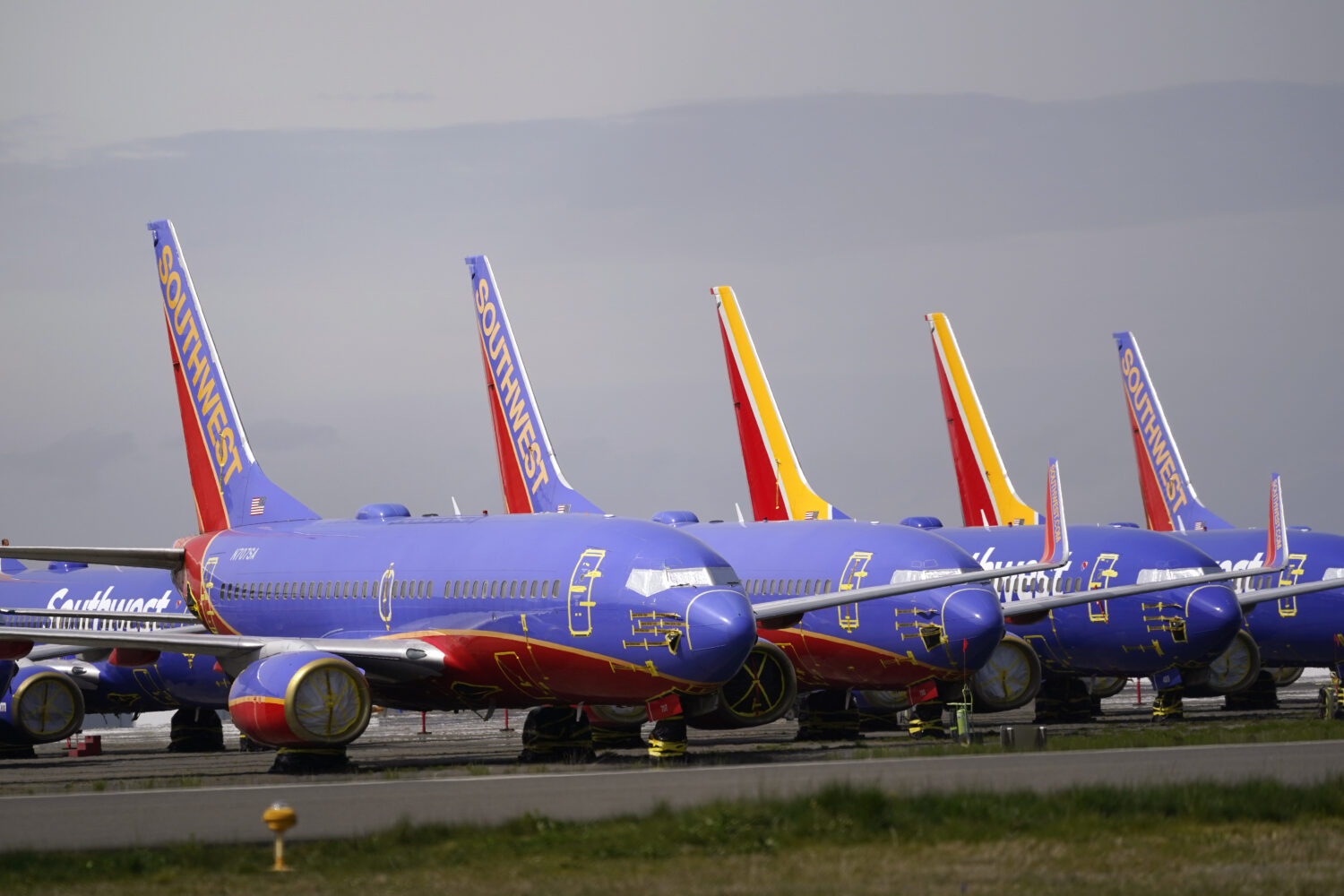 FILE - A line of Southwest Air Boeing 737 jets are parked near the company's production plant while...