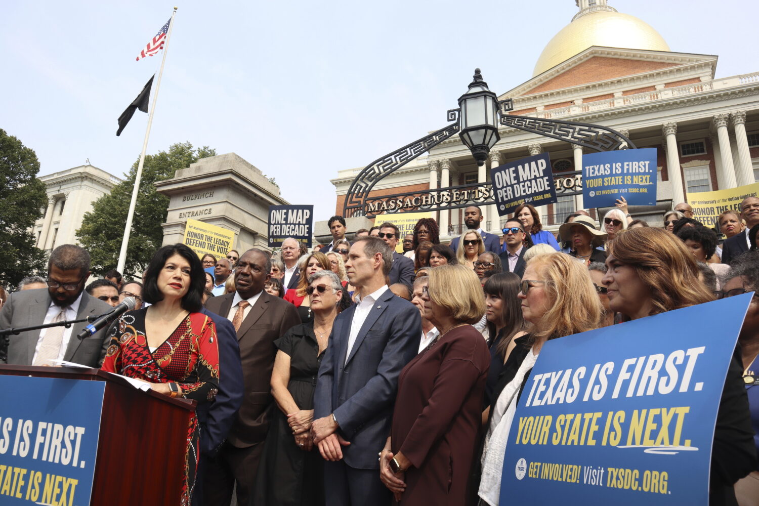 Texas State Senator Carol Alvarado, a Democrat, speaks in a crowd of other Democratic state lawmake...