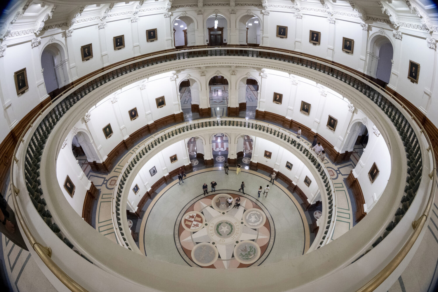 Visitors explore the rotunda into the late night as the Senate takes a recess before hearing more d...