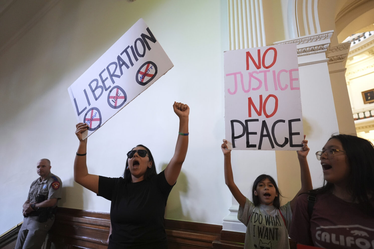 Protesters chant outside of the House Chamber where Democratic Texas Rep. Nicole Collier refuses to...