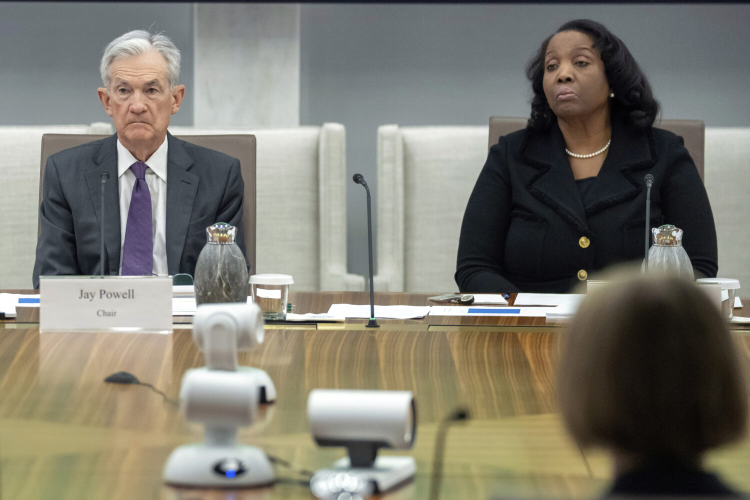 FILE - Federal Reserve Chairman Jerome Powell, and Board of Governors member Lisa Cook, right, list...