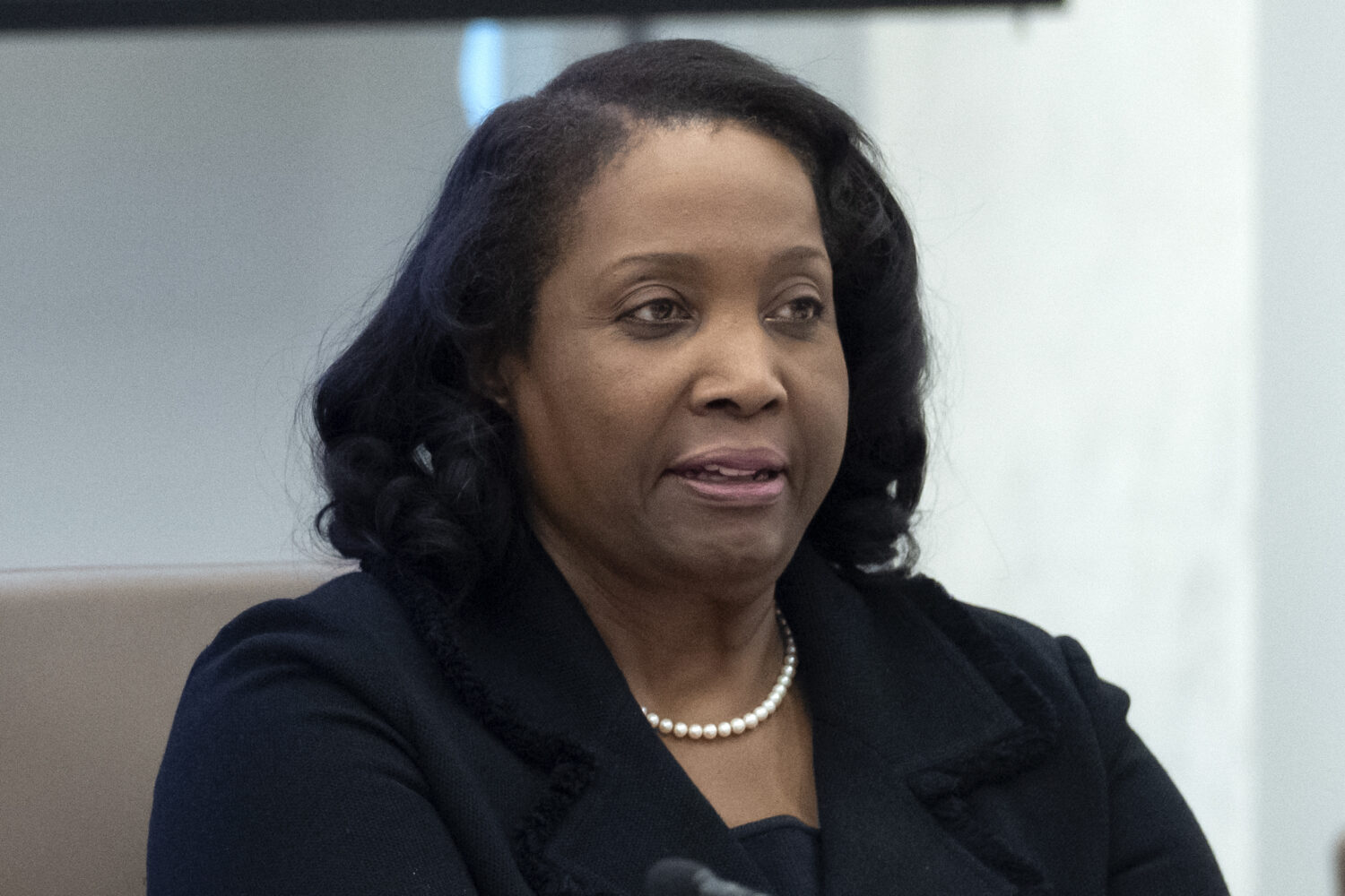 FILE - Federal Reserve Board of Governors member Lisa Cook listens during an open meeting of the Bo...