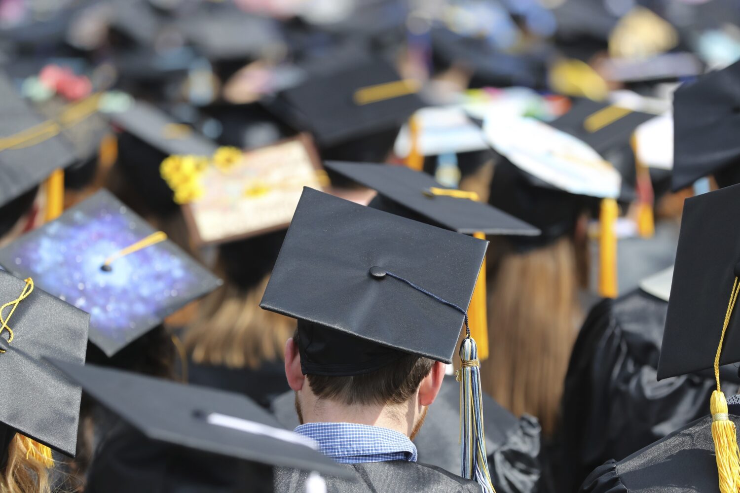 FILE - In this May 5, 2018, file photo, graduates at the University of Toledo commencement ceremony...