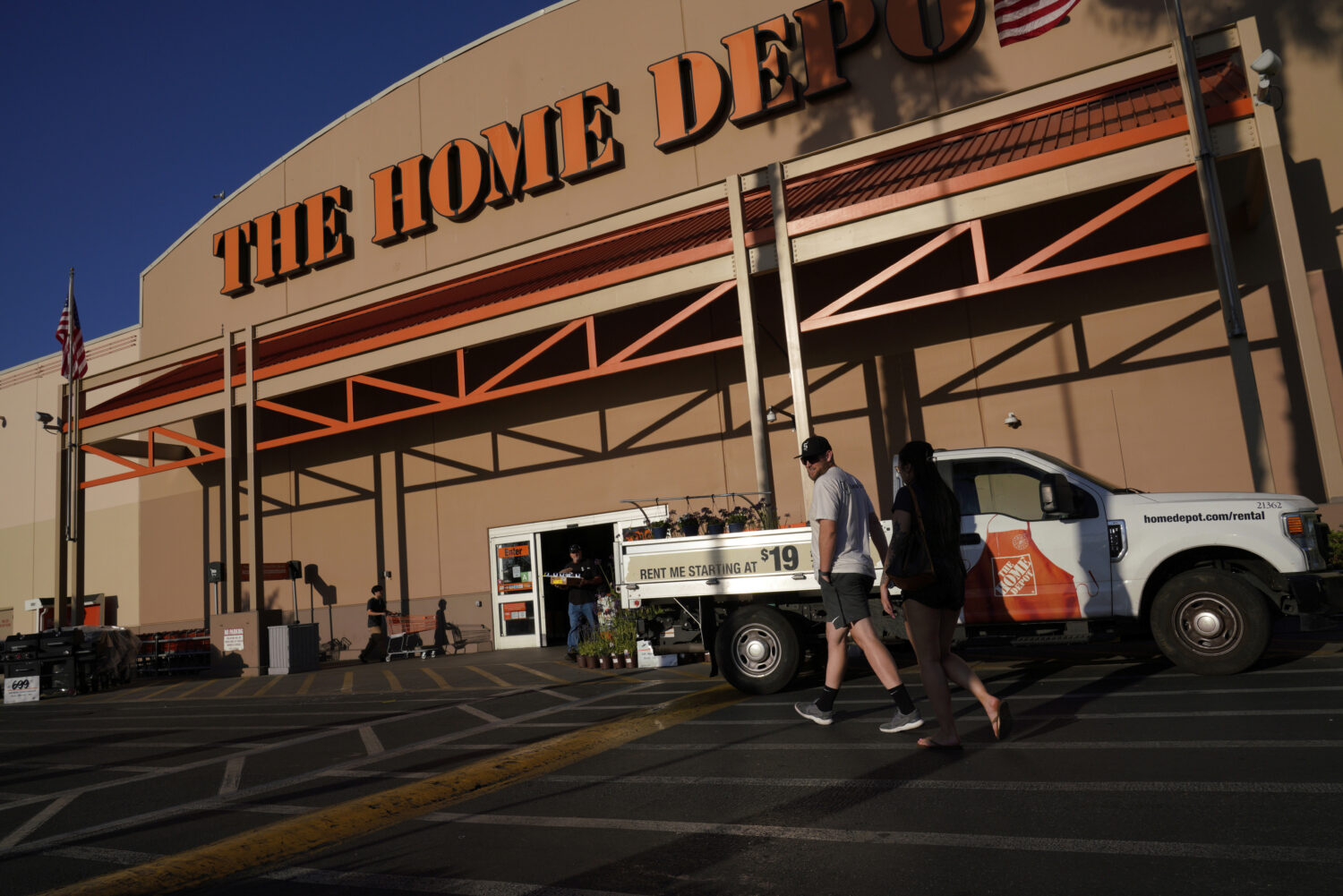 FILE - Customers arrive at The Home Depot store in the Van Nuys section of Los Angeles on July 24, ...