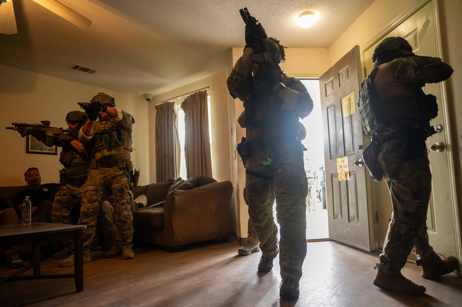 Immigration and Customs Enforcement (ICE) Special Response Team members demonstrate how the team en...