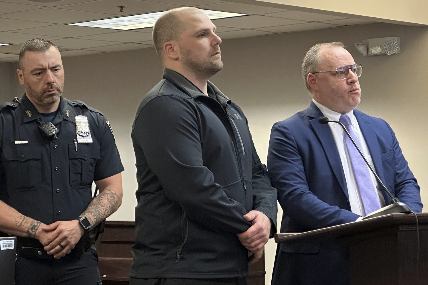 FILE - Correctional officer Christopher Walrath, center, appears in Oneida County Court, Monday, Ma...
