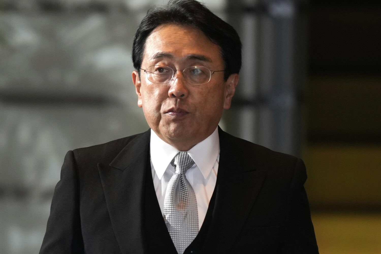FILE - Ryosei Akazawa, newly appointed Minister in charge of Economic Revitalization, arrives at th...
