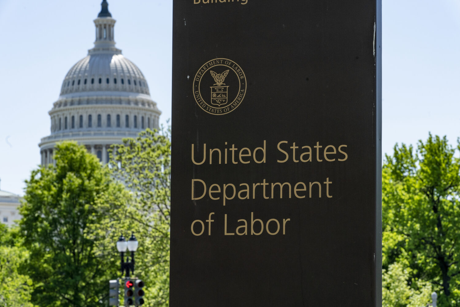 FILE - The entrance to the Labor Department is seen near the Capitol in Washington, May 7, 2020. (A...