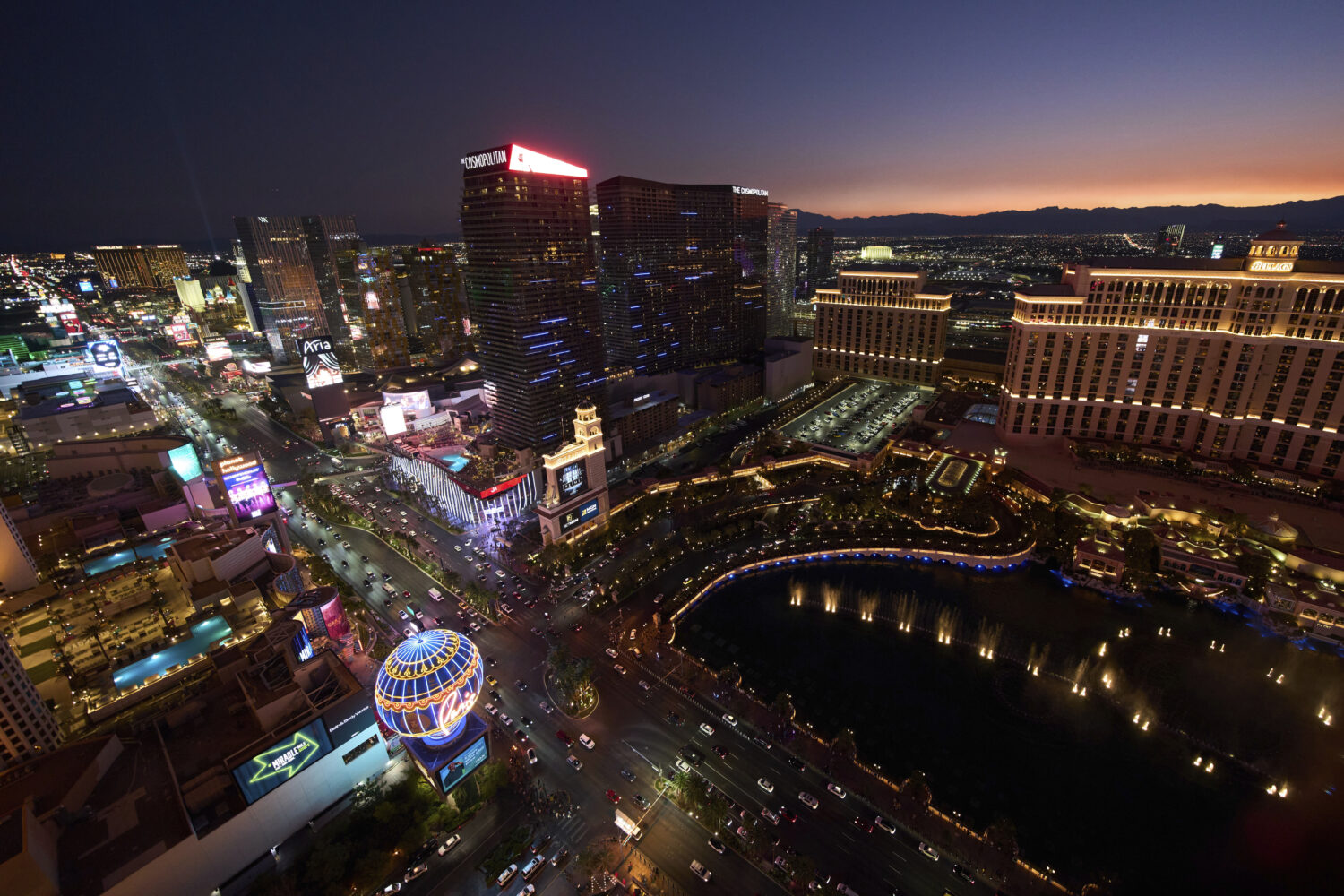 Cars drive along the Las Vegas Strip, Saturday, Aug. 2, 2025, in Las Vegas. (AP Photo/John Locher)C...