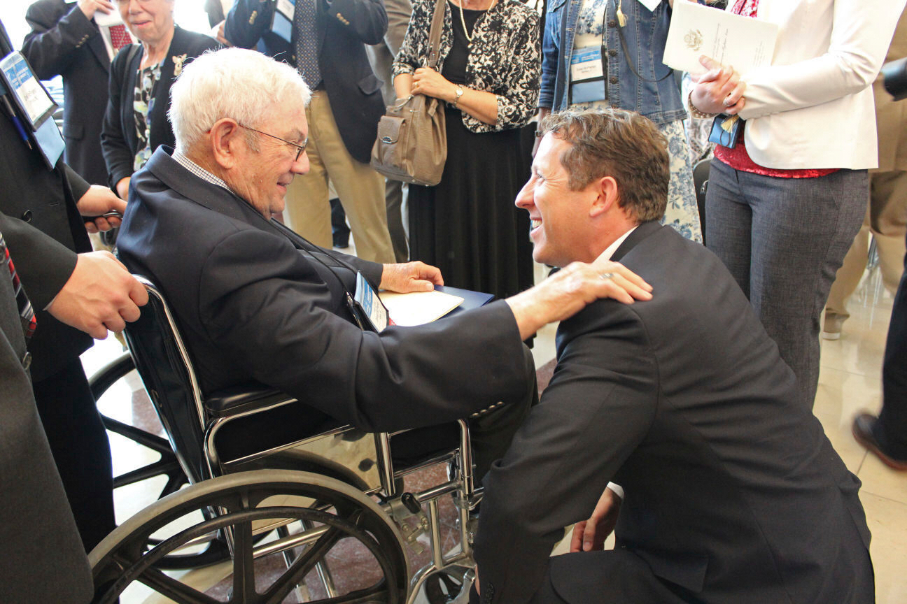 Rep. Adrian Smith greets Congressional Gold Medal recipient Donald McPherson of Adams at the ceremo...