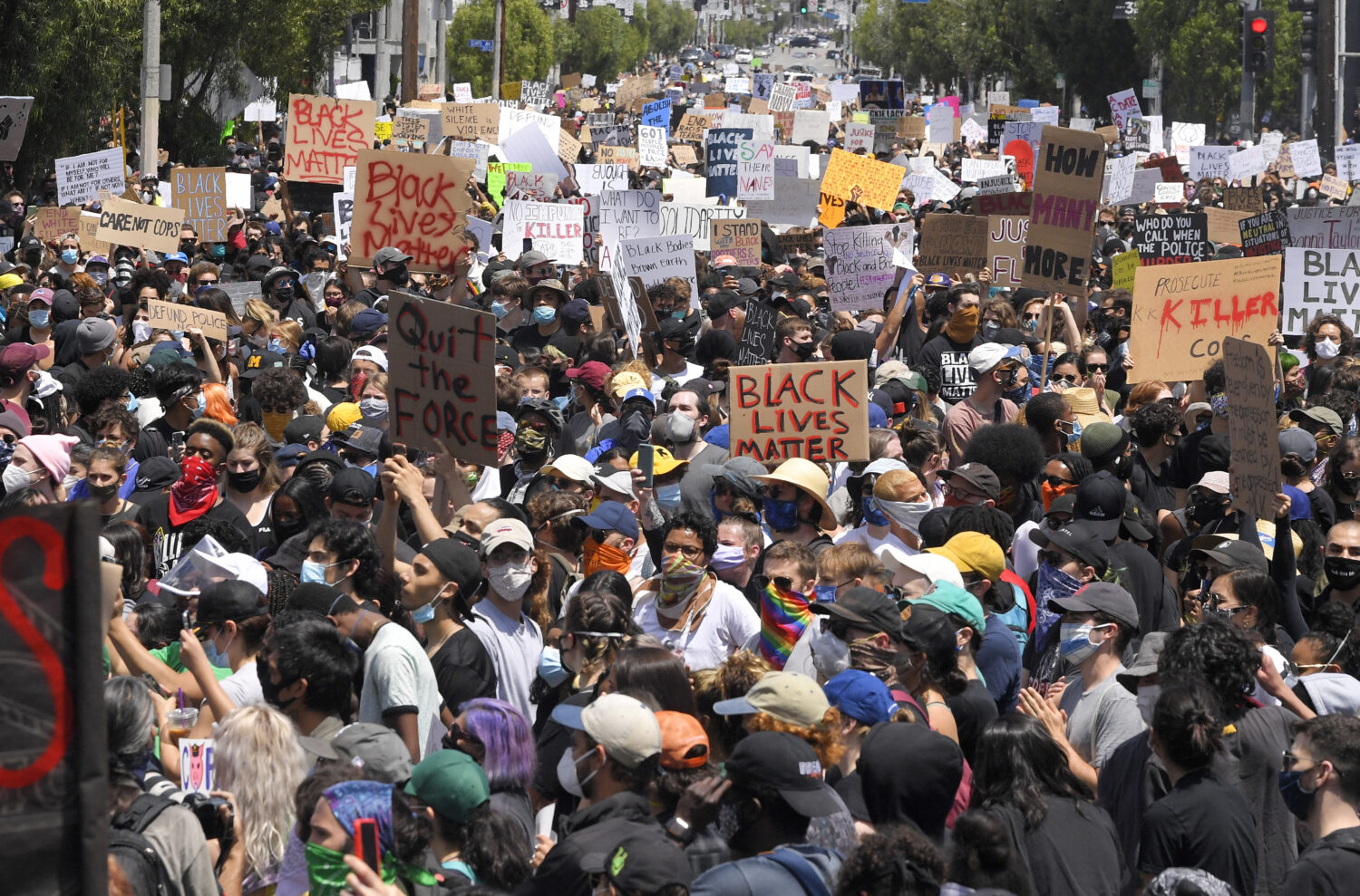 FILE - Demonstrators sit in an intersection during a protest over the death of George Floyd, on May...