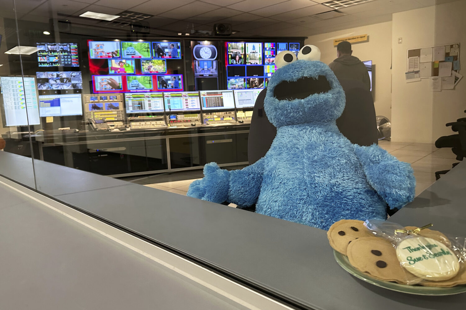 FILE - A stuffed Cookie Monster is seated in a control room at the Arizona PBS offices at the Walte...