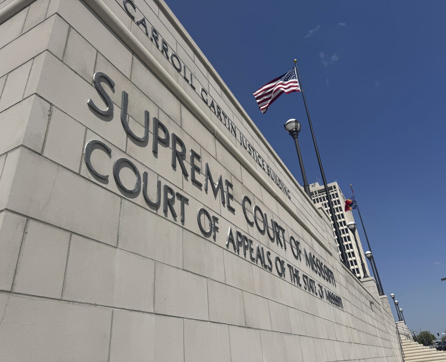 The American flag waves outside the Mississippi Supreme Court in Jackson, Miss., April 17, 2025. (A...
