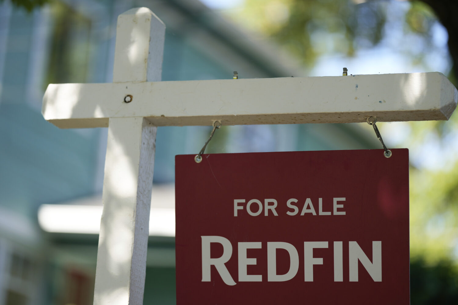 FILE - A "For Sale" sign is displayed outside a home on Friday, July 11, 2025, in Portland, Ore. (A...