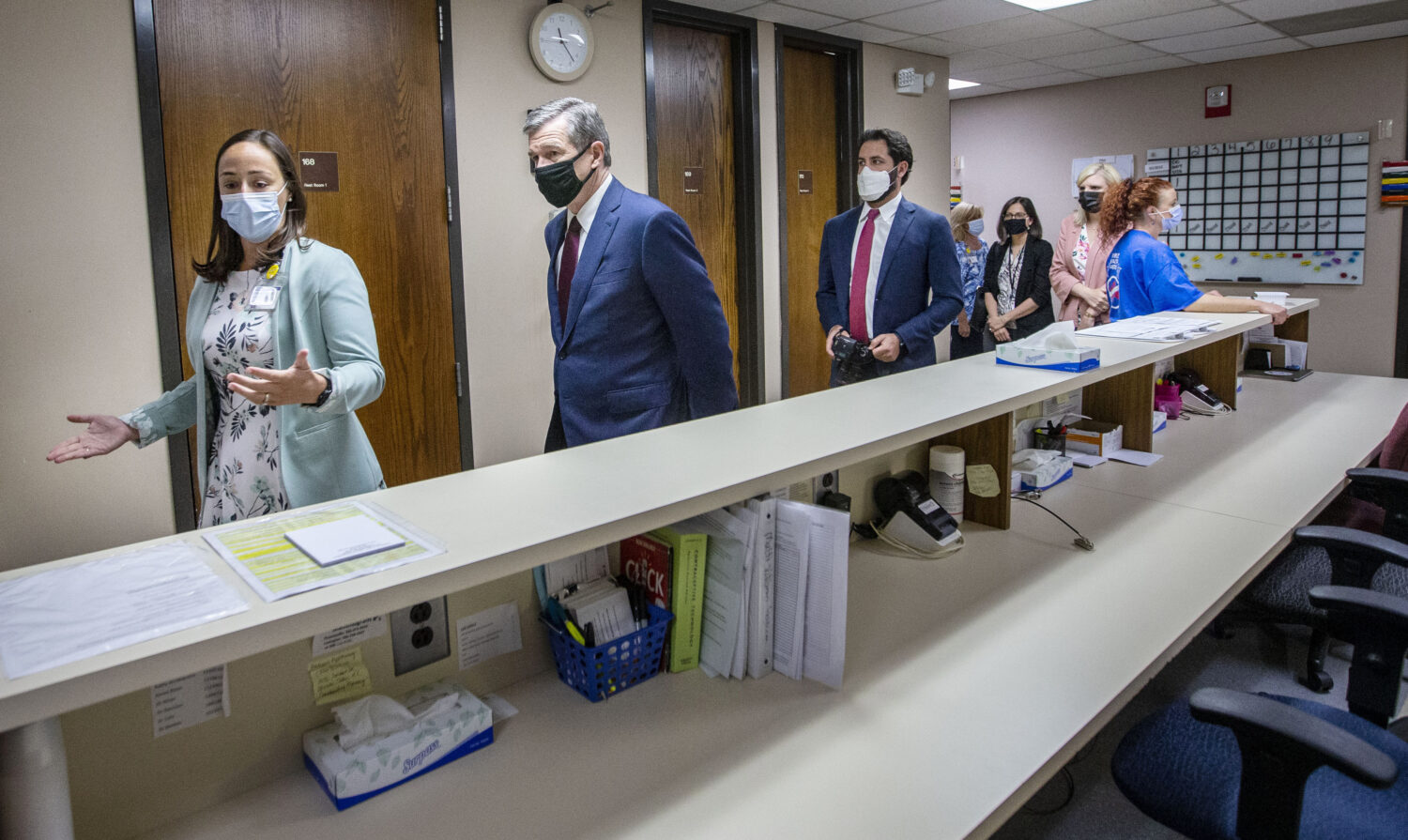 FILE - Health Director Lillian B. Koontz leads North Carolina Gov. Roy Cooper on a tour of the COVI...