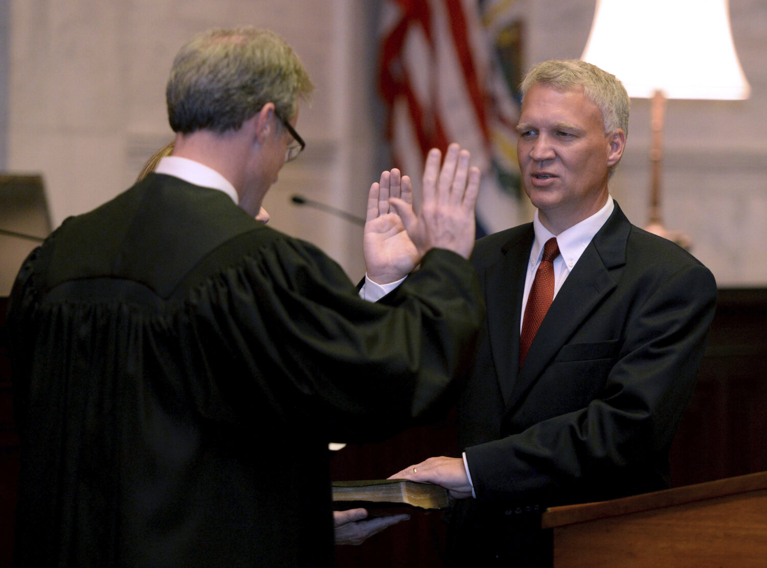 FILE - Tim Armstead, right, former speaker of the West Virginia House of Delegates, is sworn in as ...