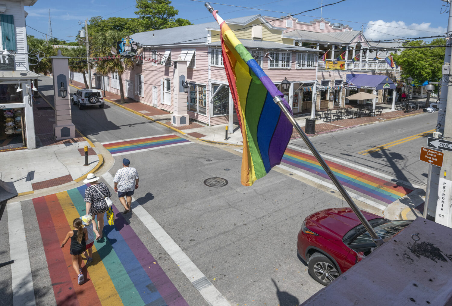 A family crosses one of four rainbow crosswalks on Duval Street in Key West, Fla., Tuesday, Aug. 26...