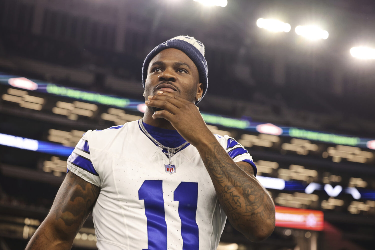 Dallas Cowboys defensive end Micah Parsons walks onto the field after the team's preseason NFL foot...