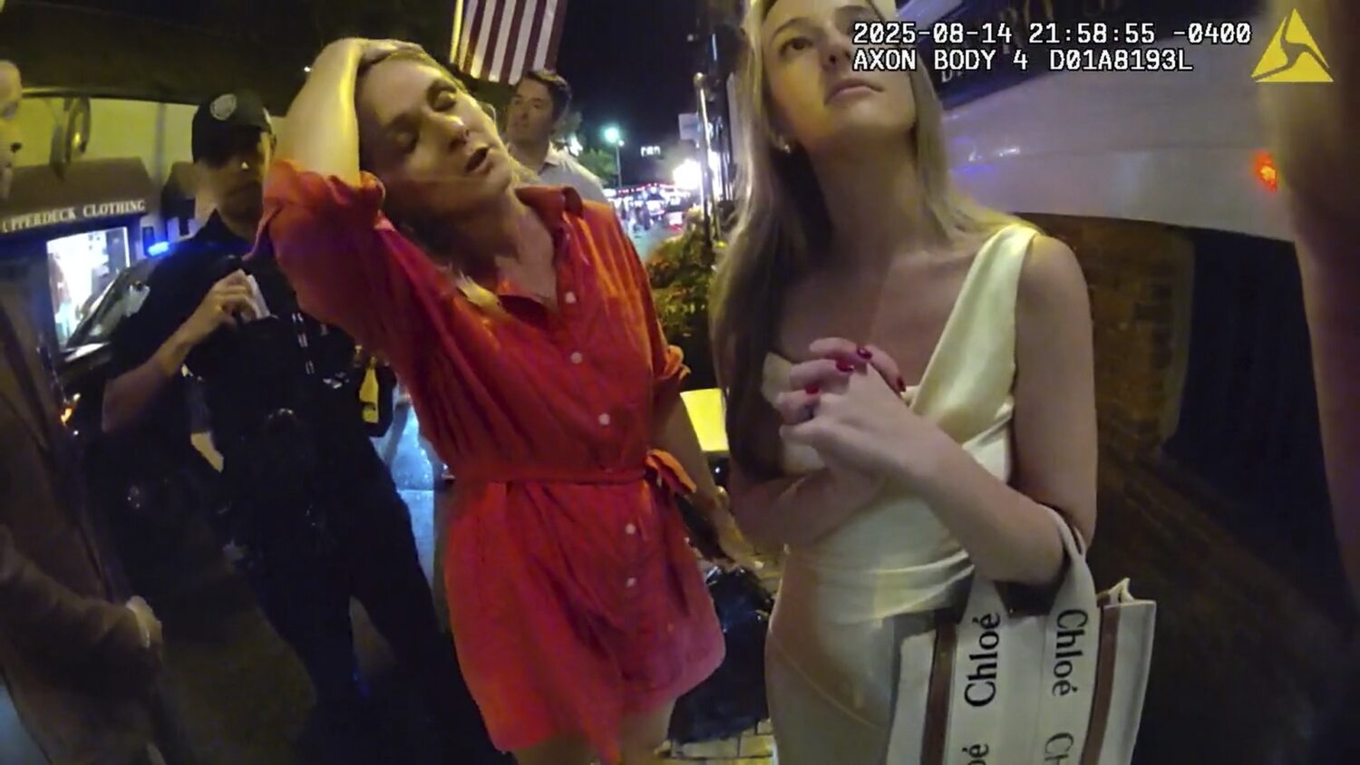 In an image taken from police body camera footage, Newport Police officers interacting with Rhode I...