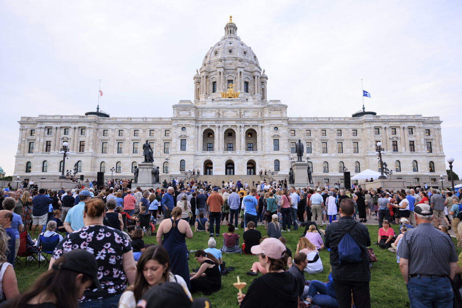 FILE - People attend a candlelight vigil for former House Speaker Melissa Hortman and her husband M...