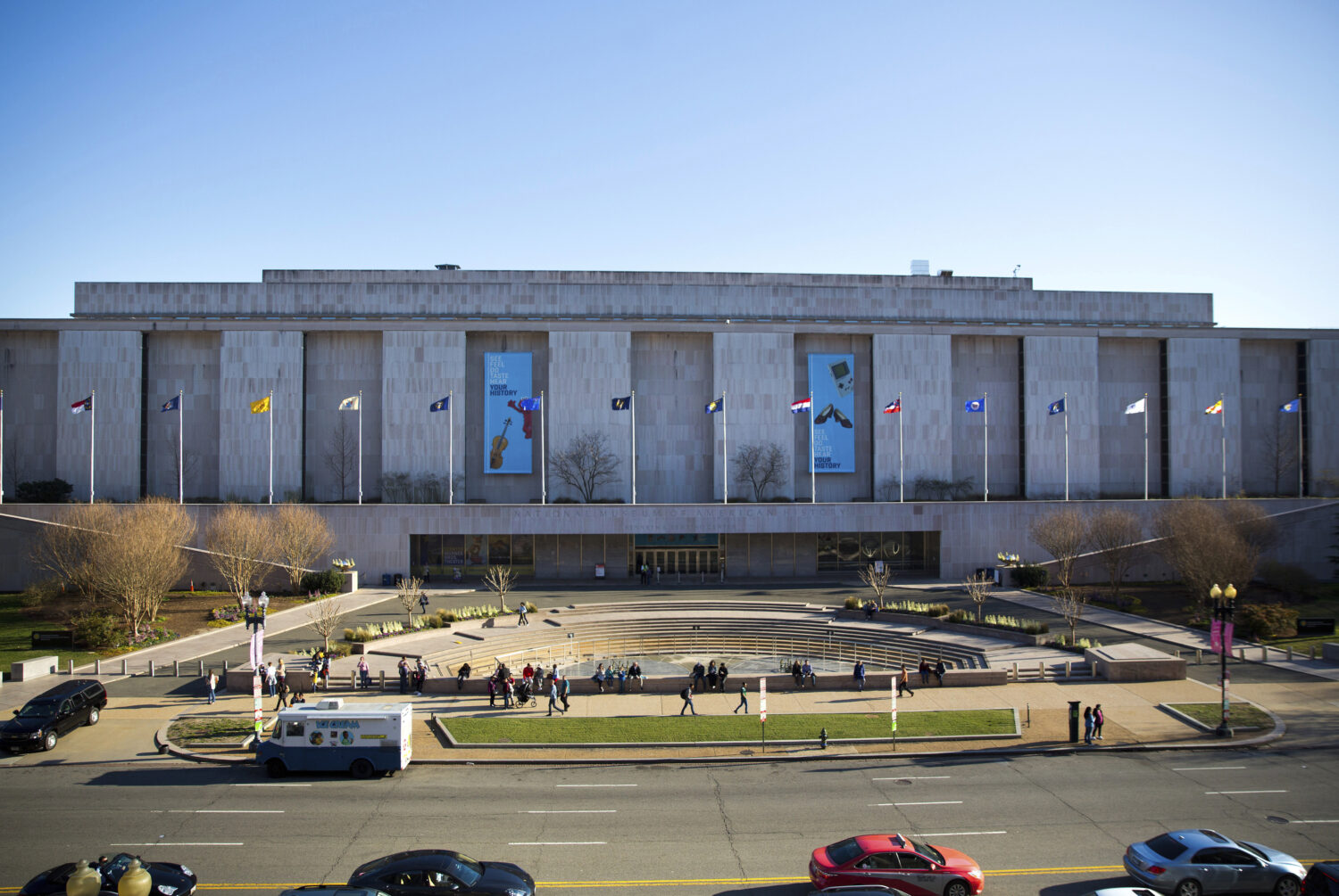 FILE - People visit the Smithsonian Museum of American History on the National Mall in Washington, ...