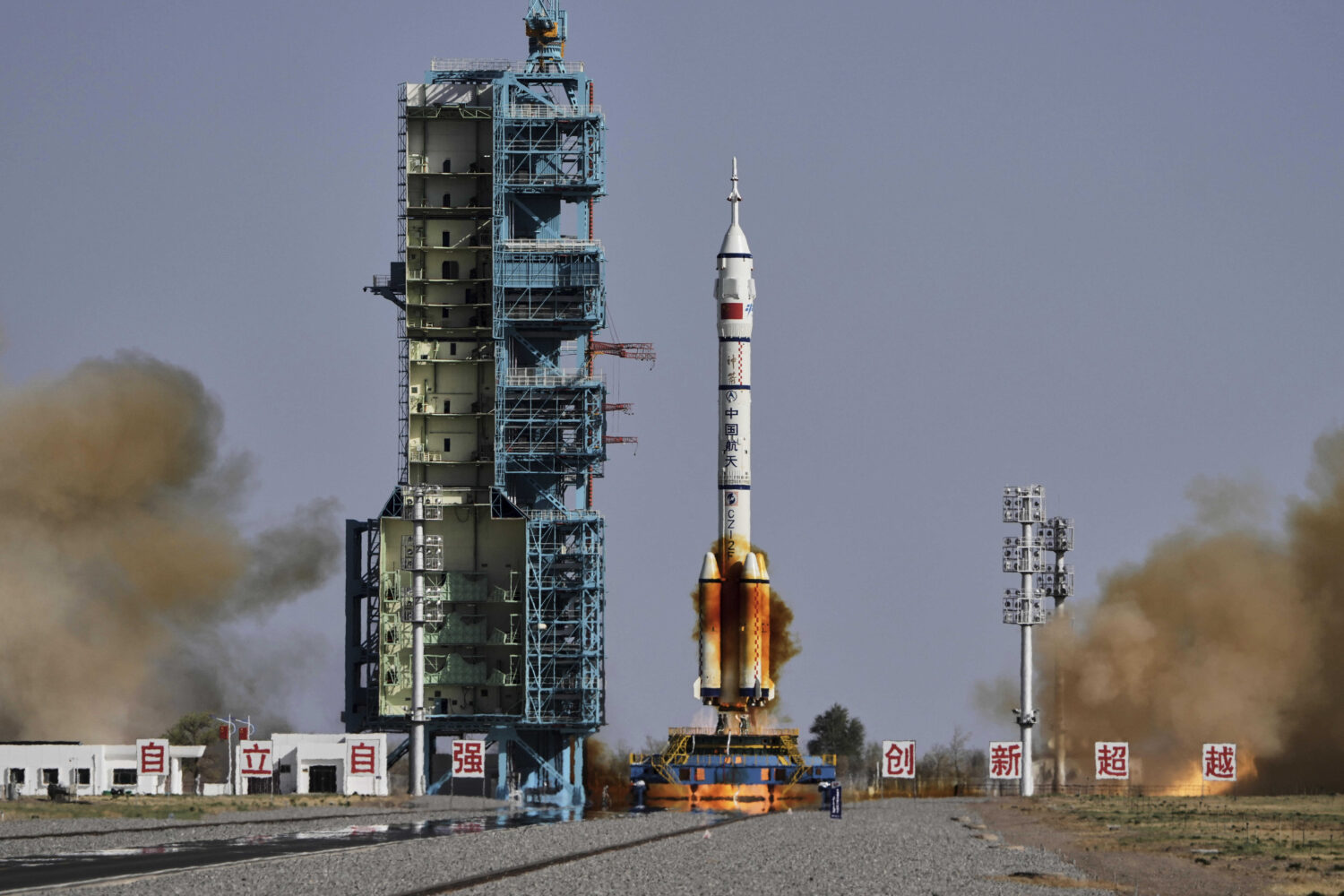 FILE - China's Long March 2F rocket, carrying three astronauts for the Shenzhou 20 manned space mis...