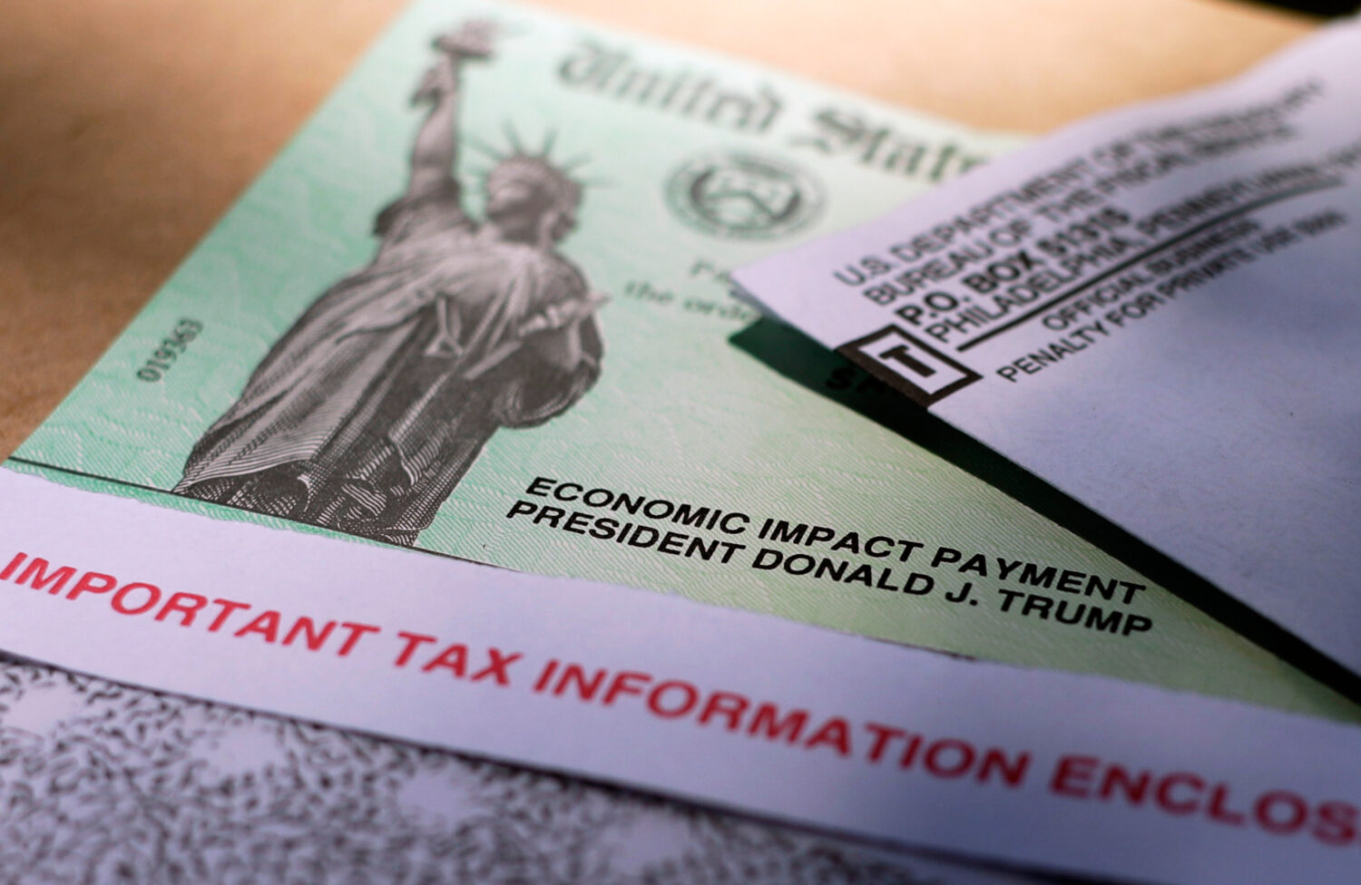 FILE - President Donald Trump's name is printed on a stimulus check issued by the IRS to help comba...