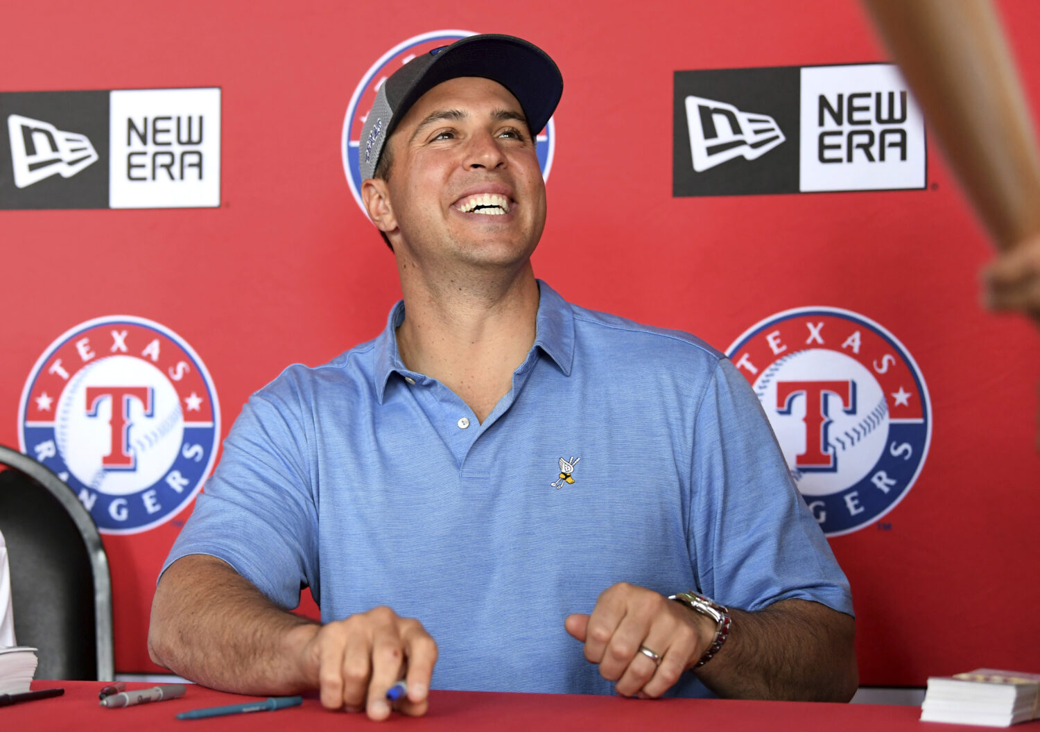 FILE - Former Texas Rangers first baseman Mark Teixeira signs autographs before a baseball game bet...