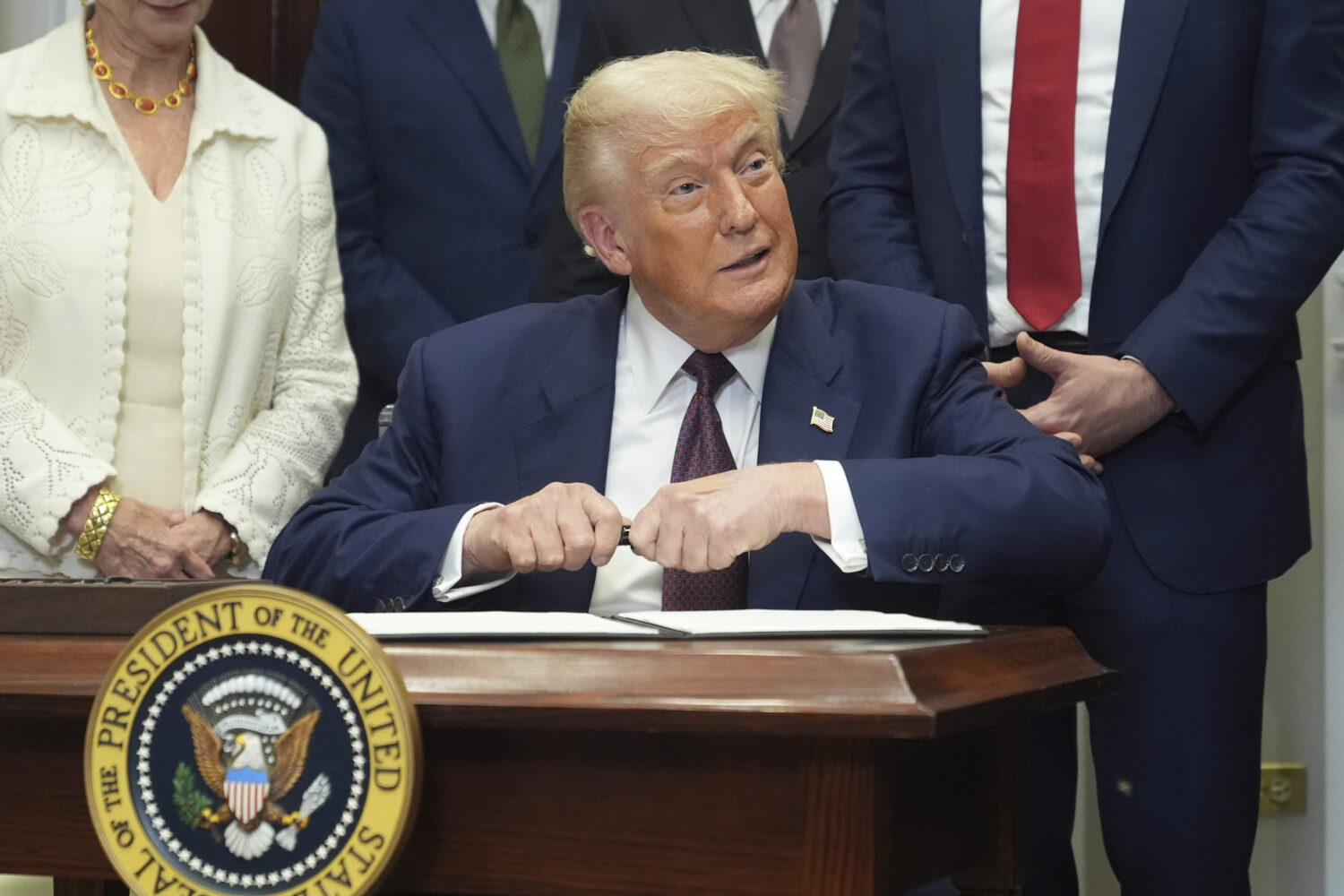 President Donald Trump signs an executive order restarting the Presidential Fitness Test in public ...