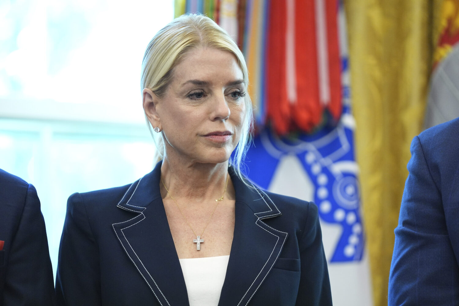 Attorney General Pam Bondi listens as President Donald Trump holds an executive order signing cerem...
