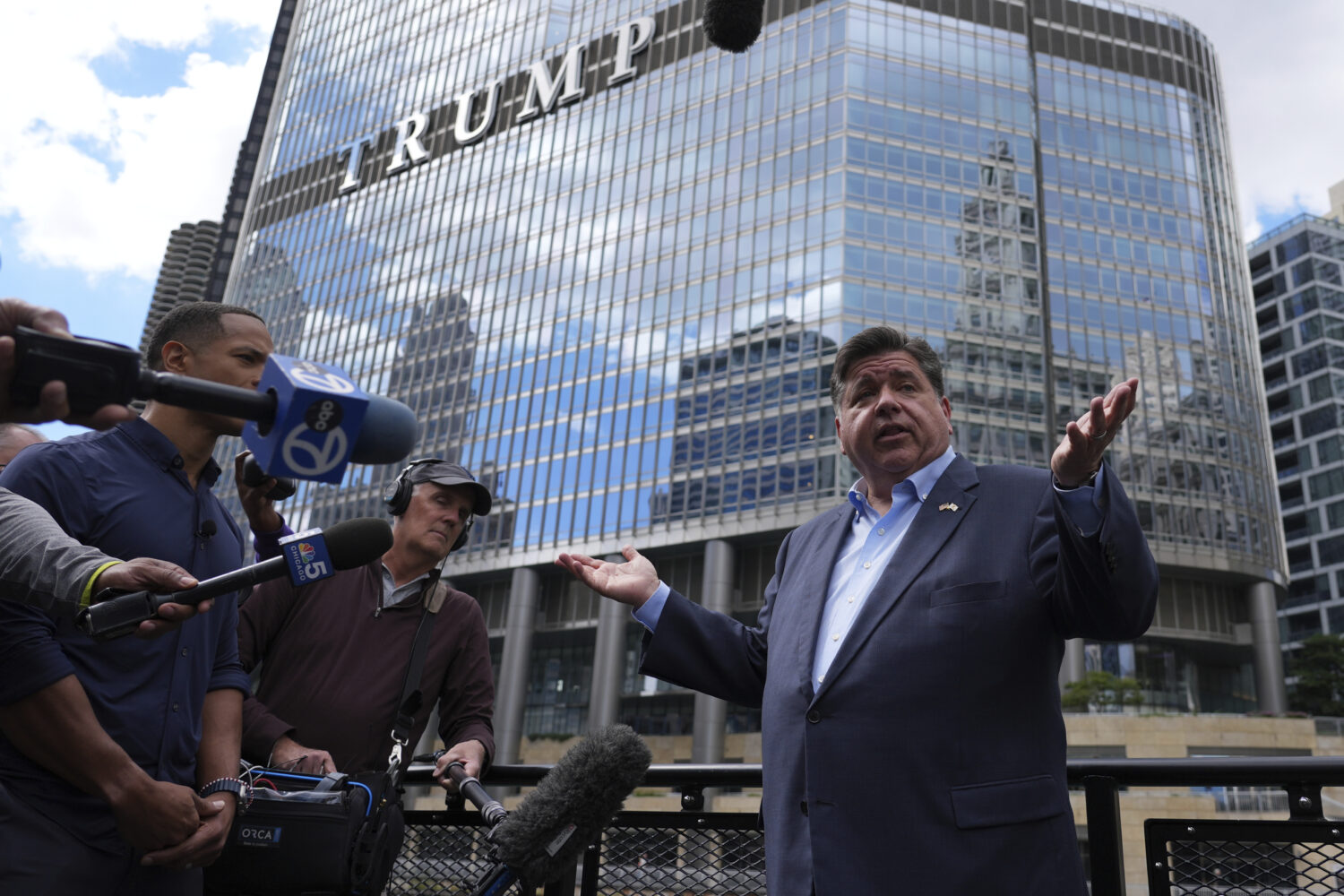 Illinois Governor JB Pritzker speaks at a news conference in a Chicago water taxi Monday, Aug. 25, ...