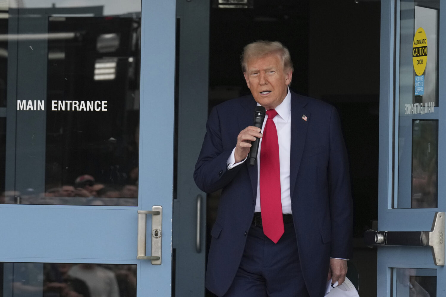 President Donald Trump speaks with members of law enforcement and National Guard soldiers, Thursday...