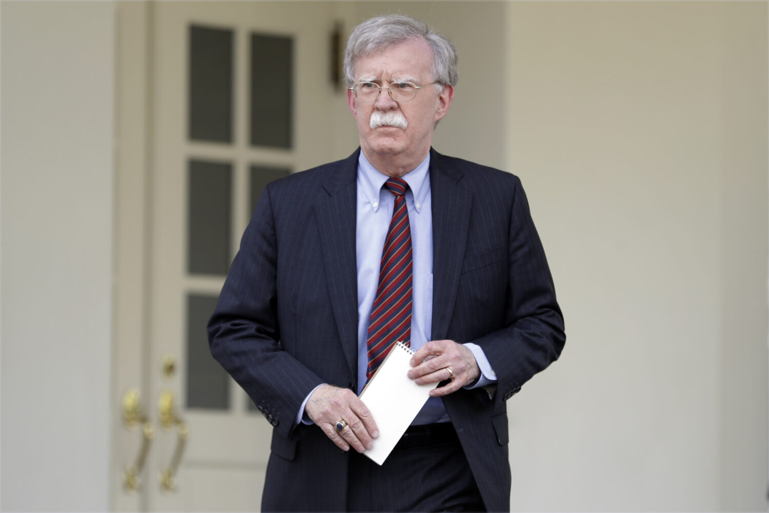 FILE - National security adviser John Bolton speaks about Venezuela outside the West Wing of the Wh...