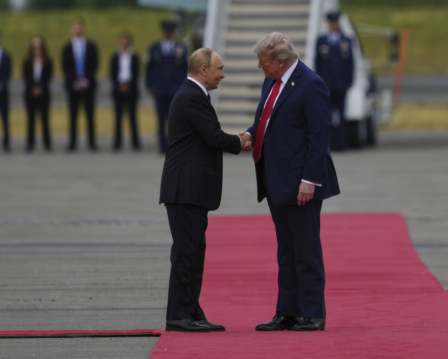 President Donald Trump greets Russia's President Vladimir Putin Friday, Aug. 15, 2025, at Joint Bas...