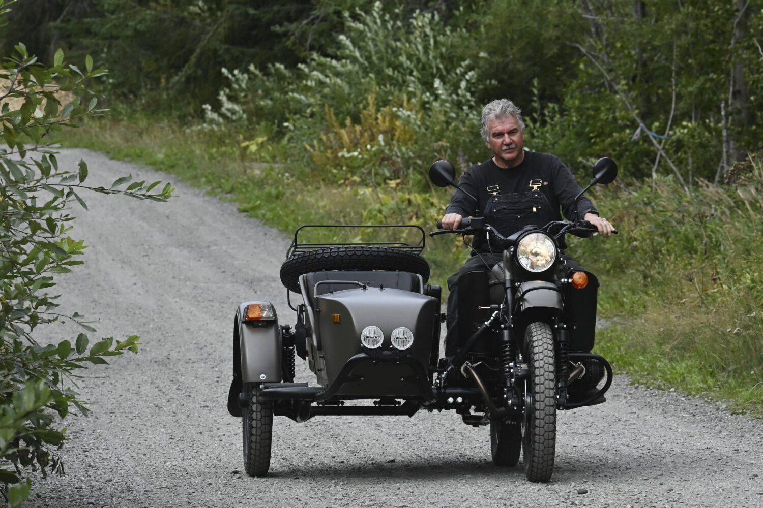Alaska resident Mark Warren rides the a new Ural motorcycle he received as a gift from the Russian ...