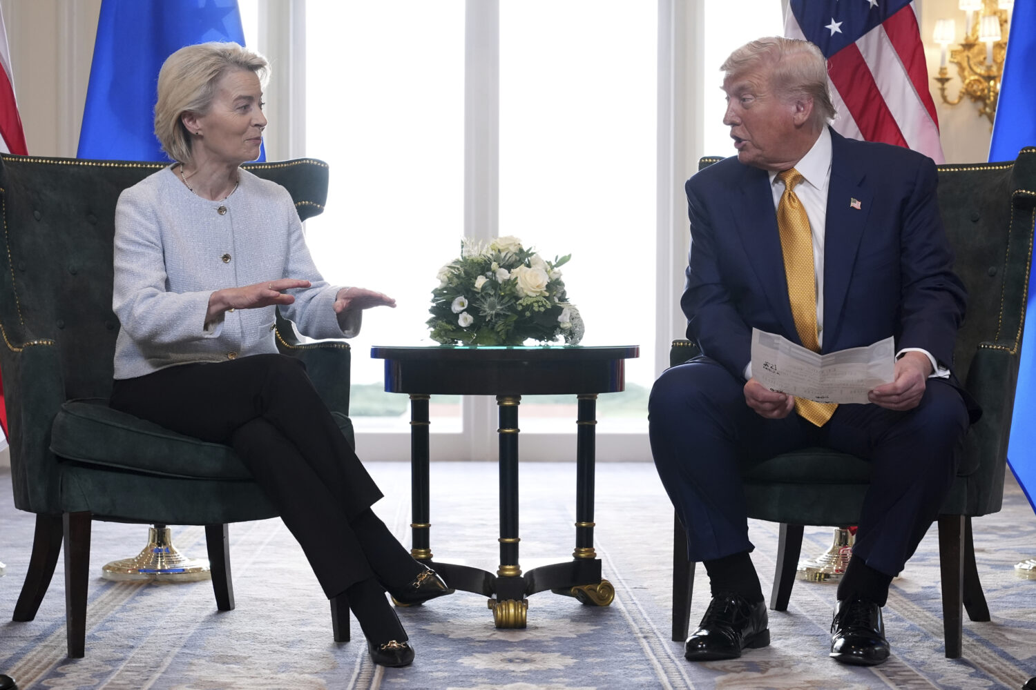 President Donald Trump and European Commission President Ursula von der Leyen talk after reaching a...