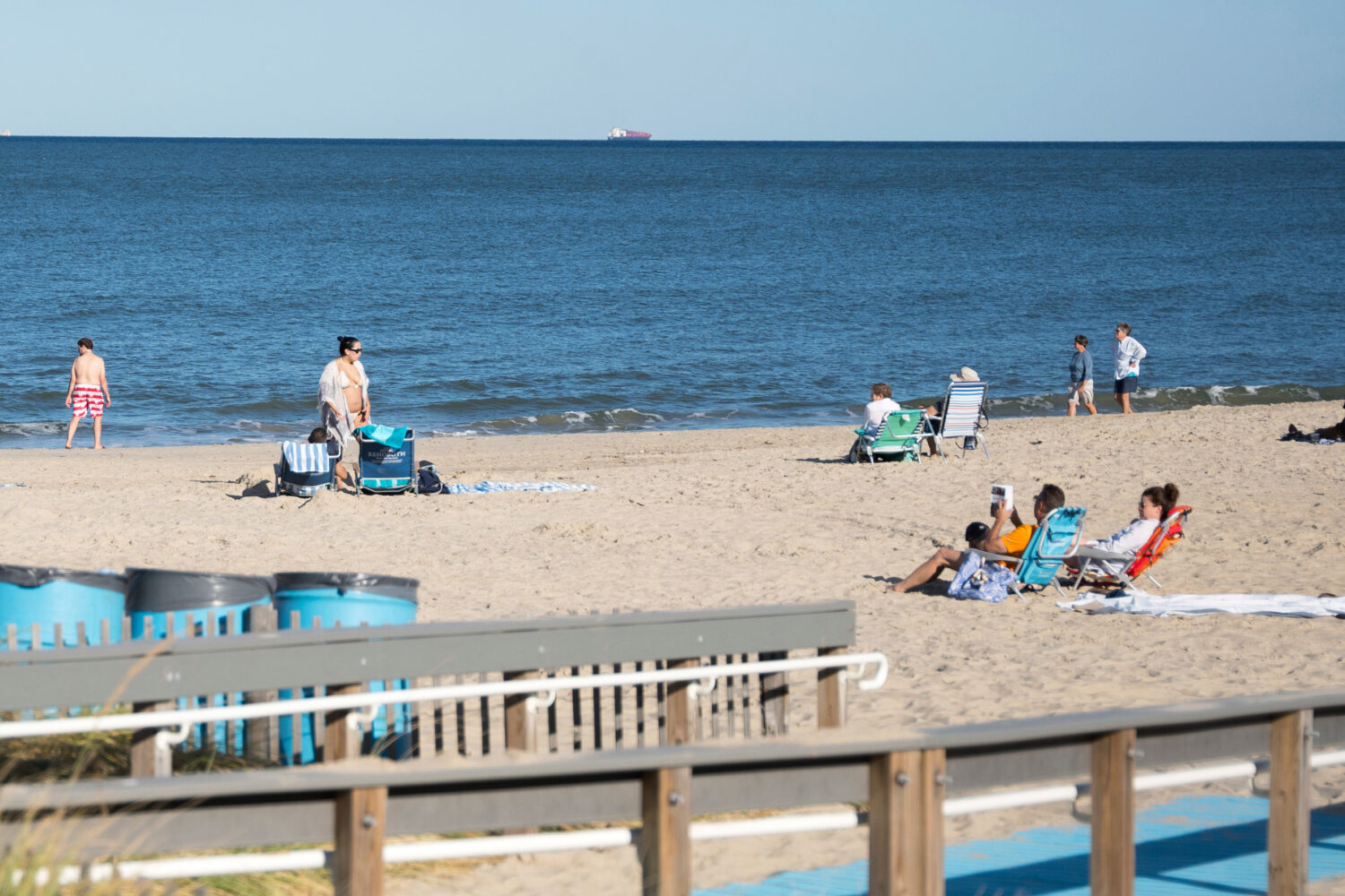 People relax at Rehoboth Beach, Del., on Wednesday, Aug. 27, 2025. (AP Photo/Mingson Lau)Credit: AS...
