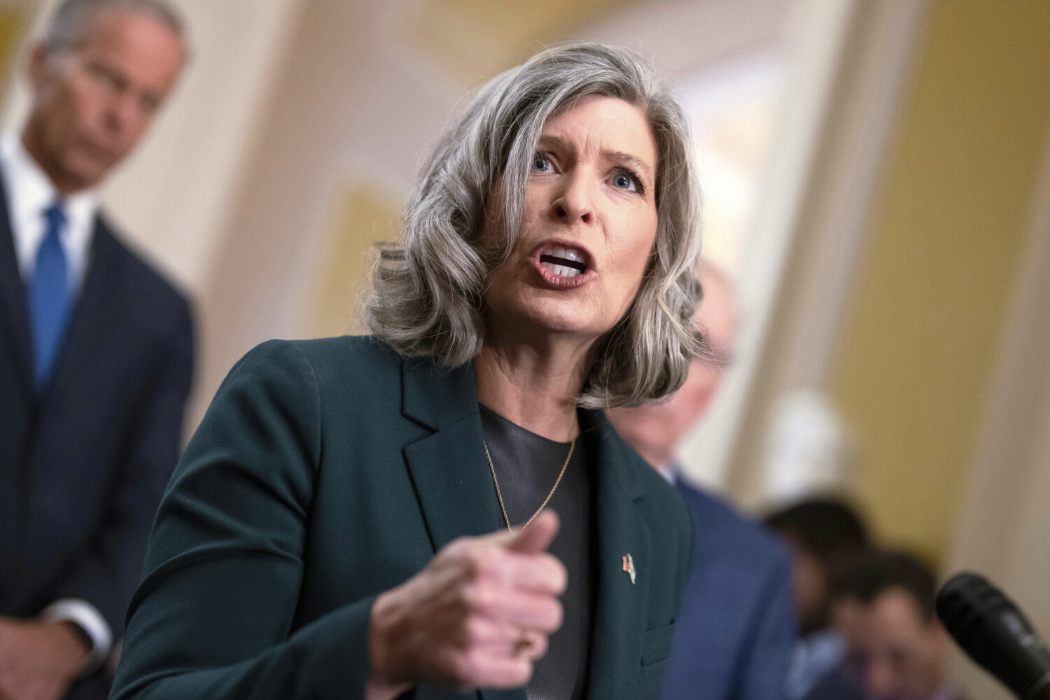FILE - Sen. Joni Ernst, R-Iowa, speak to reporters after a closed-door meeting with fellow Republic...